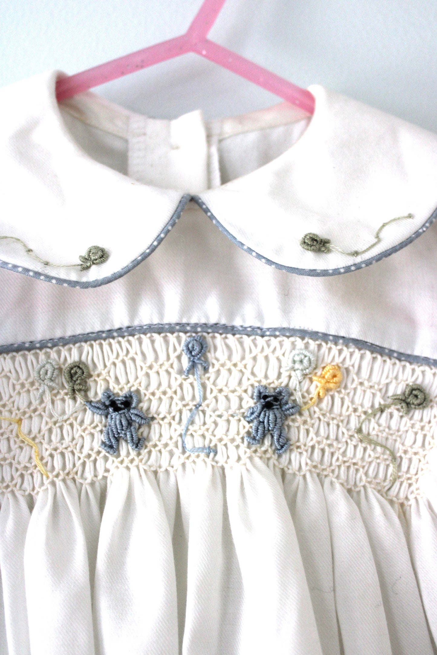 Squibbles Baby's smocked romper suit