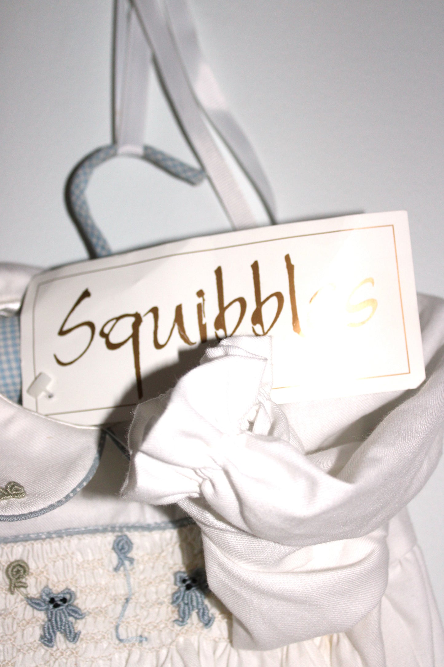 Squibbles Baby's smocked romper suit