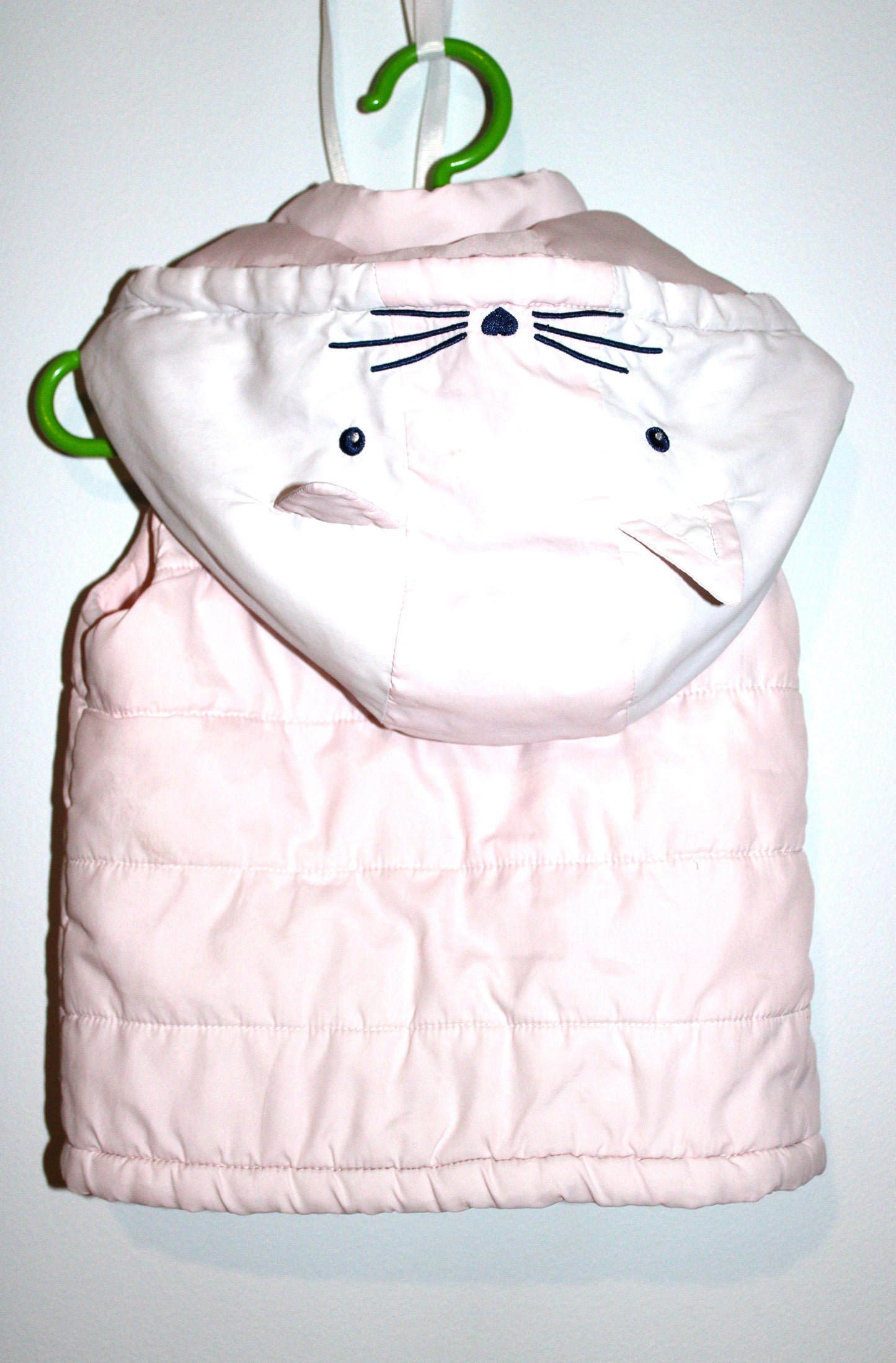 Padded pink baby's hooded vest